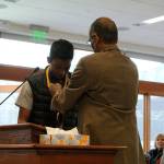 Chirag Vedullapalli receives a bronze medallion for his nonprofit work by Abraham Mathan of Prudential Financial. Madison Miller / staff photo