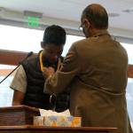 Chirag Vedullapalli receives a bronze medallion for his nonprofit work by Abraham Mathan of Prudential Financial. Madison Miller / staff photo