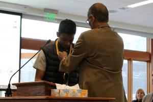 Chirag Vedullapalli receives a bronze medallion for his nonprofit work by Abraham Mathan of Prudential Financial. Madison Miller / staff photo