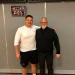 Mount Si Wildcats senior Slater Macko, left, and Mount Si Wildcats head football coach Charlie Kinnune, right, pose for a quick picture in 2019. Macko will compete in the Washington State Coaches Association all-state game this July. Photo courtesy of Charlie Kinnune