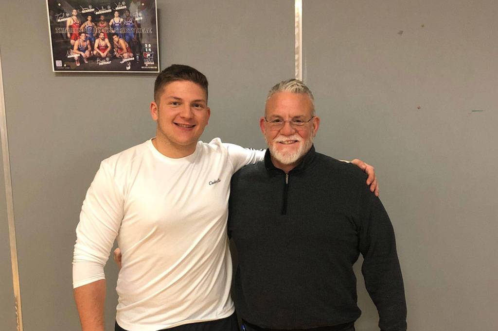 Mount Si Wildcats senior Slater Macko, left, and Mount Si Wildcats head football coach Charlie Kinnune, right, pose for a quick picture in 2019. Macko will compete in the Washington State Coaches Association all-state game this July. Photo courtesy of Charlie Kinnune