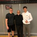 Mount Si lineman Cody Frederick, left, and Mount Si wide receiver Jonny Barrett, right, pose for a photo with Wildcats head coach Charlie Kinnune. Photo courtesy of Charlie Kinnune