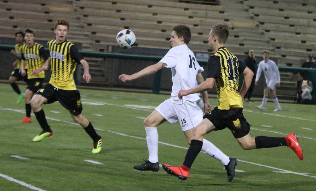 Mount Sis Sullivan Smith (center) controls the ball while Inglemoor players stay close during the Wildcats 3-2 victory on April 9 at Pop Keeney Stadium in Bothell. At press time, Mount Si stood atop the 4A KingCo with a 5-1-0 record (10-1-0 overall). Jared Davies tallied twice and Banner Hovinga scored once versus Inglemoor. Andy Nystrom / staff photo