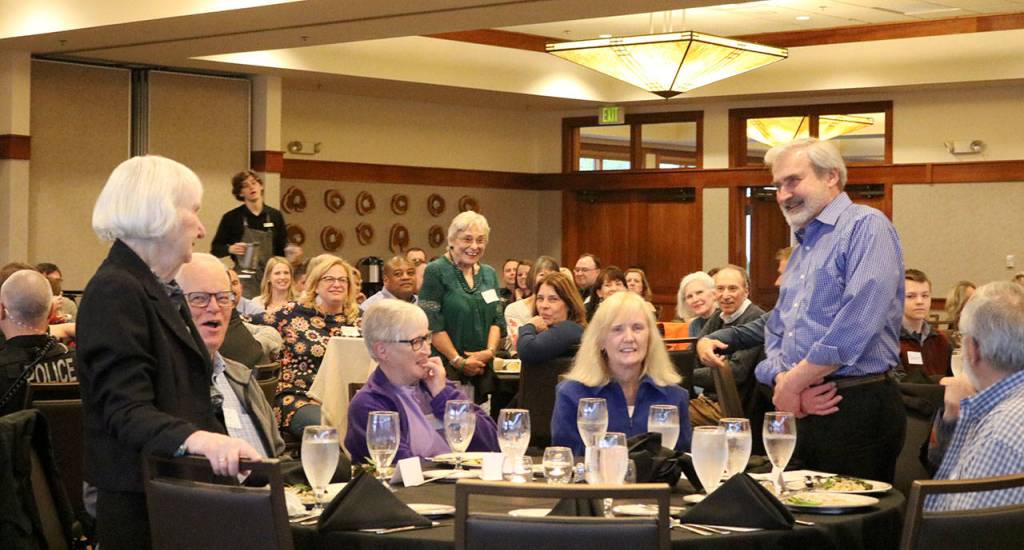 The three citizens with the longest records of volunteer work for the city of Snoqualmie receive stand and receive applause for their decades of effort. From left, Gloria McNeely, Carol Peterson, and Duane Johnson. Evan Pappas/Staff Photo