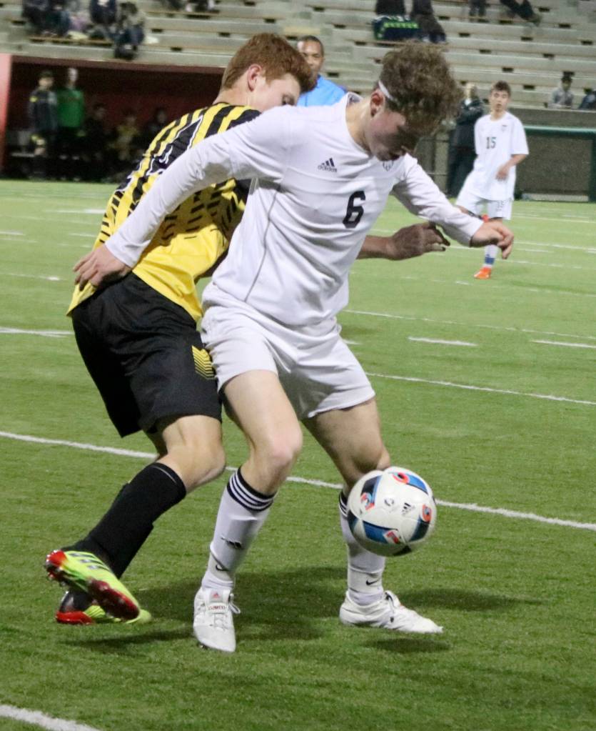 Mount Si senior midfielder Mateo Didomenico, center, controls the ball in a game earlier this season. Andy Nystrom/staff photo