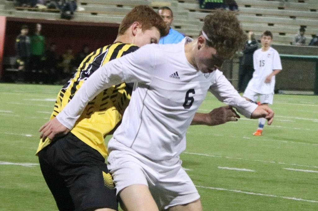 Mount Si senior midfielder Mateo Didomenico, center, controls the ball in a game earlier this season. Andy Nystrom/staff photo