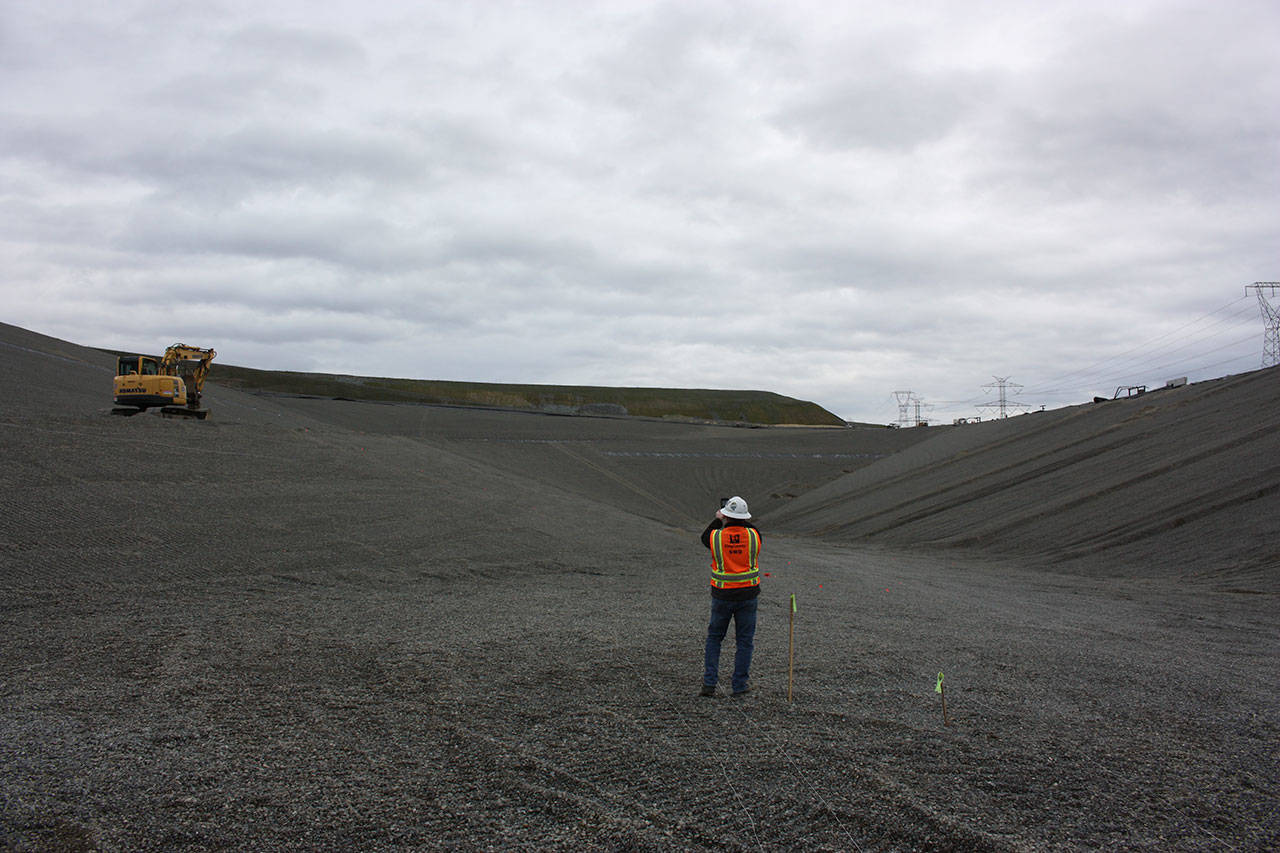 Scott Barden stands at the bottom of the massive pit of the landfills newly-built eighth section. Work on the new section has been underway for around two years. Aaron Kunkler/staff photo