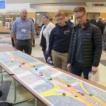 David Mills of North Bend, right, examines the map layout of the new diverging diamond design proposed for the I-90 and SR 18 interchange. Evan Pappas/Staff Photo