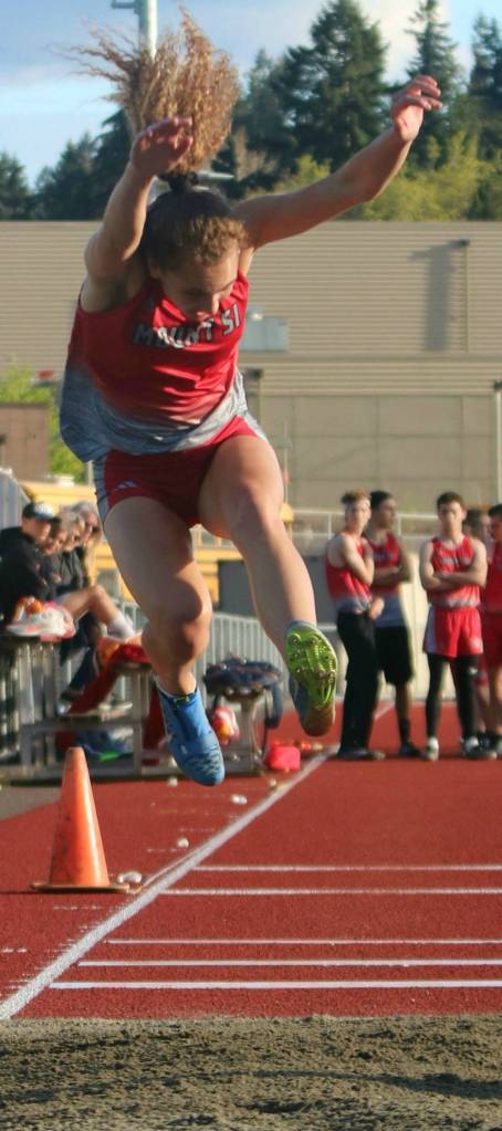 Mount Si senior Tatum Dalgleish flies through the triple jump. Andy Nystrom / staff photo