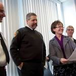Ashley Hiruko/staff photo                                County Councilmember Kathy Lambert shows off a news article about a one-year-old girl who her father, a San Francisco police officer at the time, witnessed fall. From left: Eastside Fire & Rescue Chief Jeff Clark, Snoqualmie Fire Department Chief Mark Correira, Lambert, and Dr. Brian Johnston, chief of pediatrics at Harborview Medical Center.