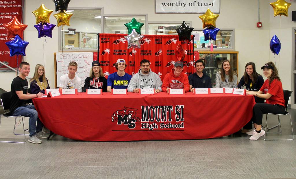 Eleven Mount Si Wildcats athletes announced where they would be competing in collegiate athletics next year during a signing-day ceremony on May 1 at Mount Si High School. Photo courtesy of Carolyn Malcolm