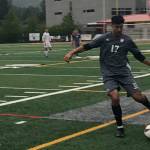 Mount Si junior defender Jake Jimenez, right, passes the ball up field to a teammate in the first half of play against the Sumner Spartans. Mount Si defeated Sumner 2-1 in the first round of the 4A state playoffs on May 15 at Mount Si High School in Snoqualmie. Shaun Scott/staff photo