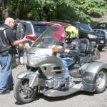 Pastor Roy Peacock greets Don Torguson at the Raging River Community Church. Evan Pappas/Staff Photo