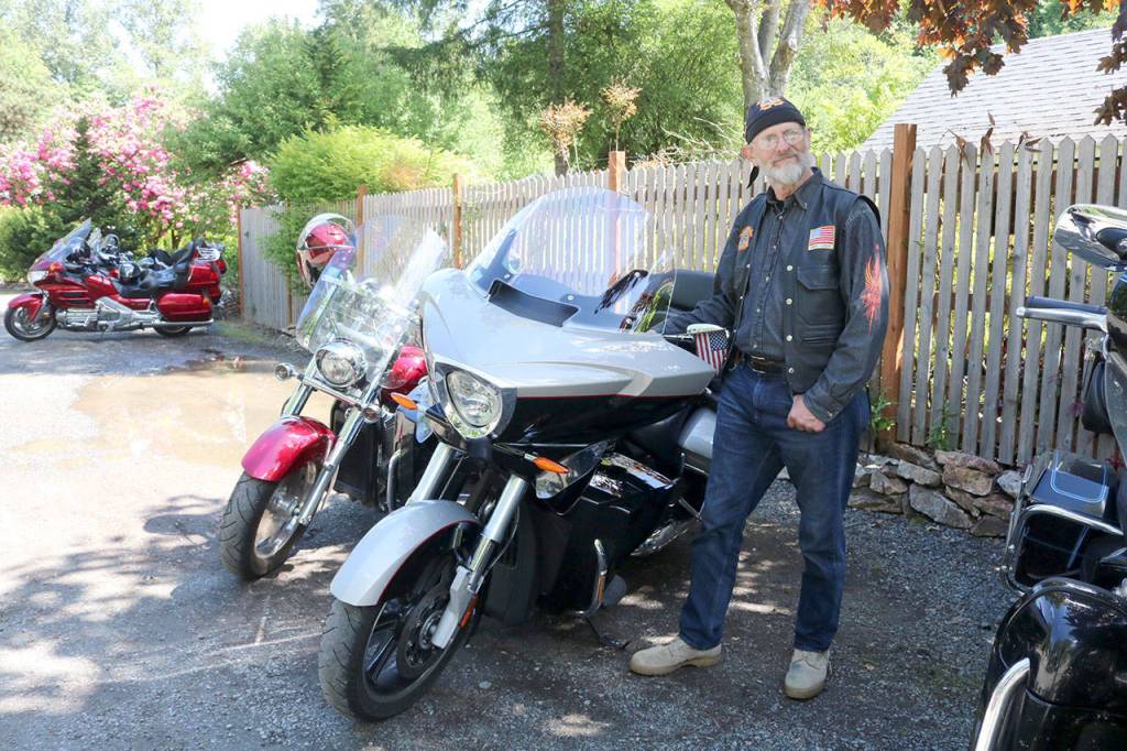 Terry Knowles, Christian Motorcycle Association member, shows off his 2014 Victory motorcycle. Evan Pappas/Staff Photo