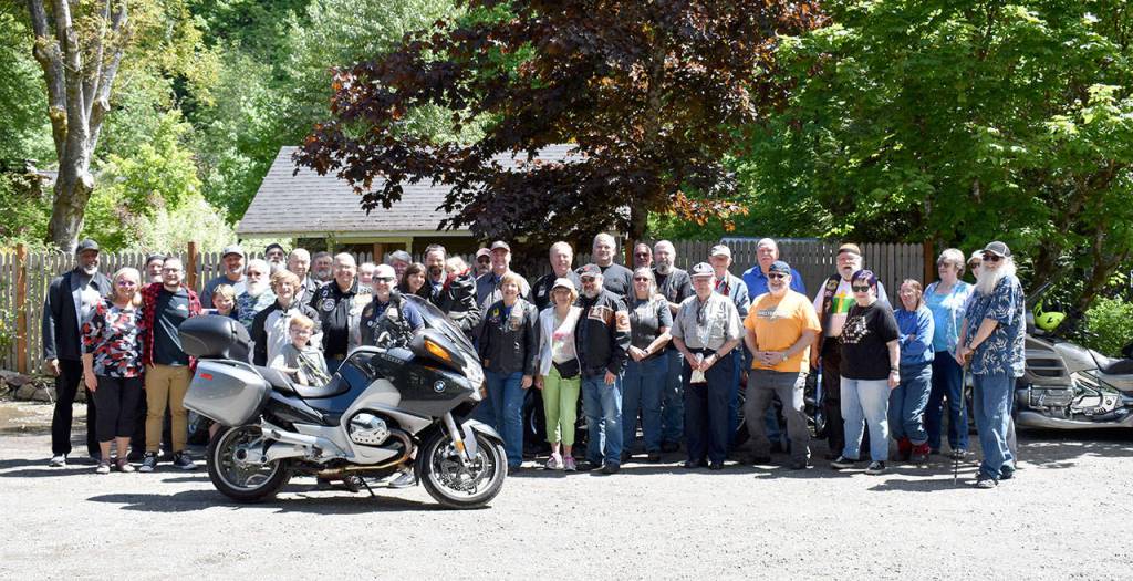 Bikers, friends, family, and church volunteers get together for a group photo at the dedication event. Dana Beatty/Courtesy Photo