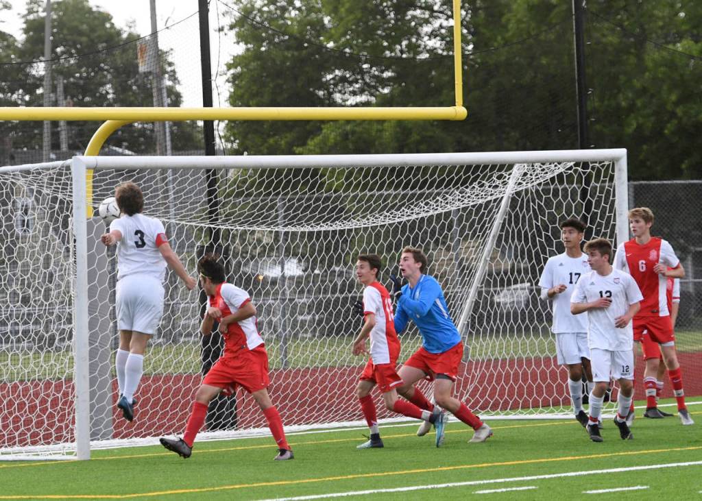 Mount Si Wildcats senior defender Reed Paradissis, left, scores a goal in the 37th minute of play, giving the Wildcats a 2-1 lead against the Ferris Saxons. Mount Si defeated Ferris 2-1 in the Class 4A state semifinals on May 24 at Sparks Stadium in Puyallup. Photo courtesy of Calder Productions