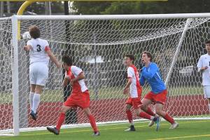 Mount Si Wildcats senior defender Reed Paradissis, left, scores a goal in the 37th minute of play, giving the Wildcats a 2-1 lead against the Ferris Saxons. Mount Si defeated Ferris 2-1 in the Class 4A state semifinals on May 24 at Sparks Stadium in Puyallup. Photo courtesy of Calder Productions