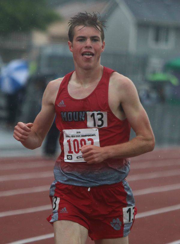 Mount Si senior Joe Waskom hits the finish line after winning the 3200 race at the 4A state track and field meet. Andy Nystrom /staff photo