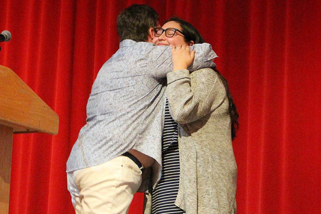 Marcella Murphy gives senior Elena Lopez the first AVID medallion that all the AVID seniors will wear at graduation from this year forward. Madison Miller / staff photo