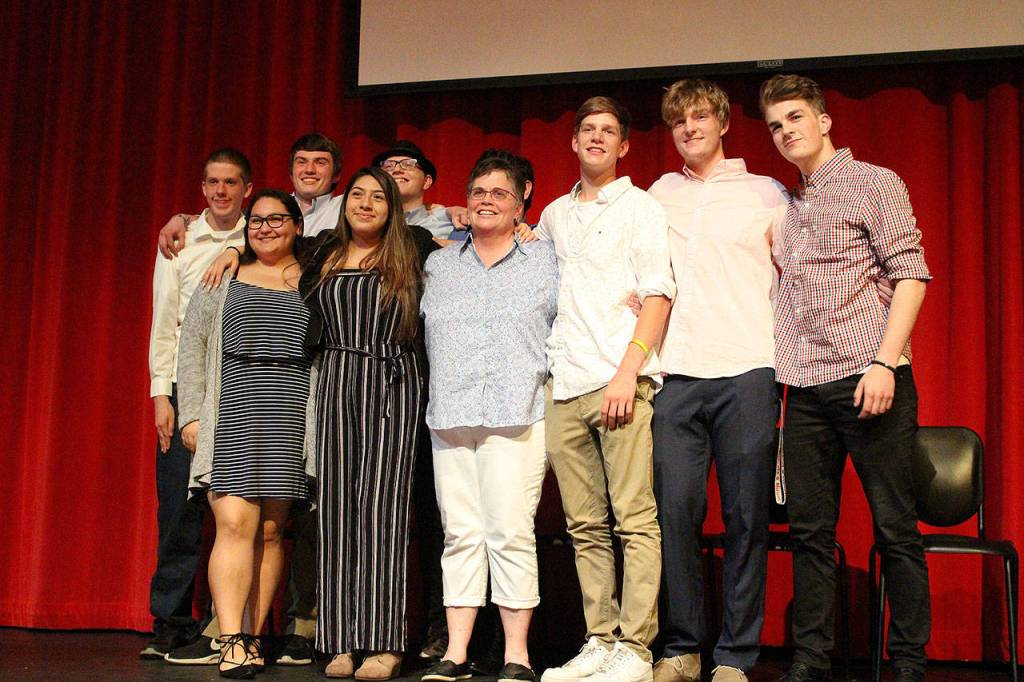Madison Miller / staff photo                                Mount Si High School will graduate nine AVID seniors as part of the programs inaugural class. From left, Gabe Burbink, Elena Lopez, Sean Gaffney, Jocelyn Morales, Richard Anderson, Justin Wotton (behind Murphy) Marcella Murphy (teacher), Joe Harris, Frankie Cepeda and Niko Cepeda.
