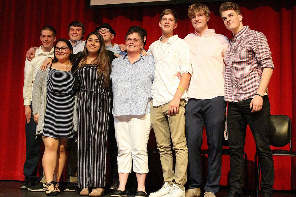 Madison Miller / staff photo                                Mount Si High School will graduate nine AVID seniors as part of the programs inaugural class. From left, Gabe Burbink, Elena Lopez, Sean Gaffney, Jocelyn Morales, Richard Anderson, Justin Wotton (behind Murphy) Marcella Murphy (teacher), Joe Harris, Frankie Cepeda and Niko Cepeda.