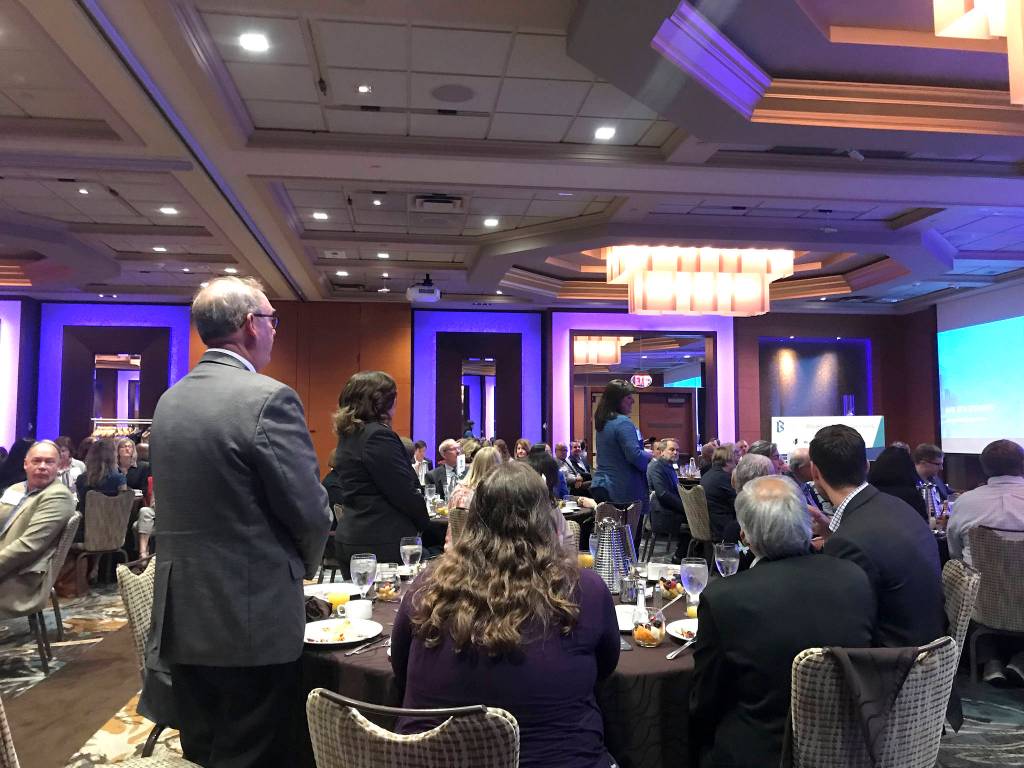 Bellevue Mayor John Chelminiak stands as former Washongton Gov. Christine Gregoire, who now serves as CEO of Challenge Seattle, thanked local officials for their effort to work with Microsoft in curbing the affordable housing crisis. Kailan Manandic / staff photo