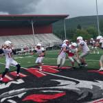 Mount Si Wildcats junior quarterback Clay Millen, left, drops back in the pocket before delivering a pin-point pass during a spring practice session on June 6 at Mount Si High School in Snoqualmie. Shaun Scott/staff photo
