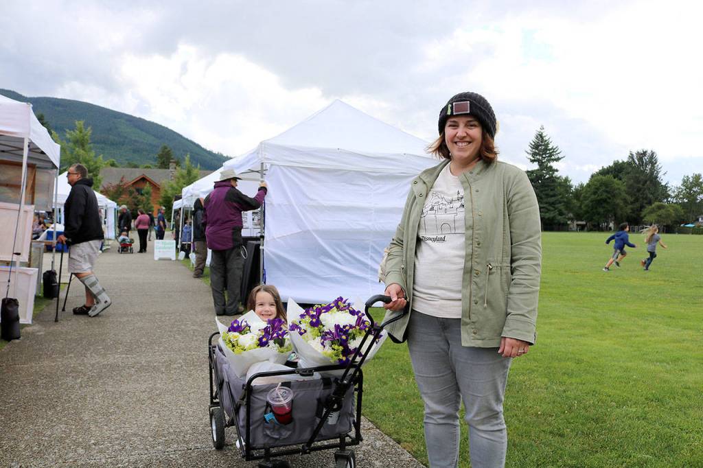 Nicole Tougher and daughter Sophia, 3, of Snoqualmie at the North Bend Farmers Market opening day on June 6.