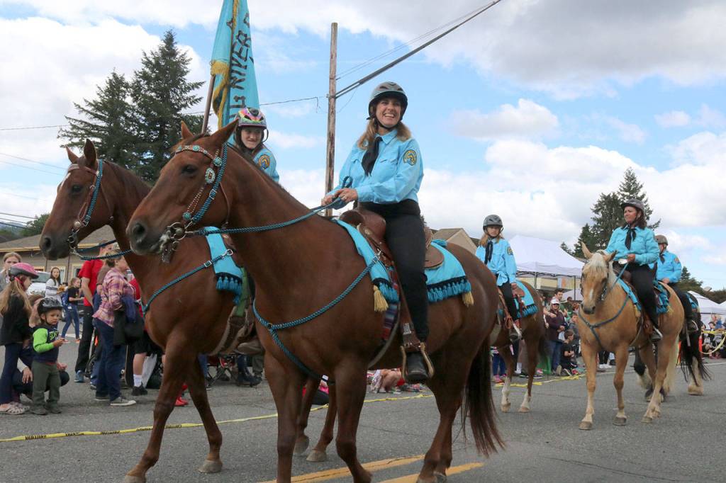 The Raging River Riding Club rides through the parade. Evan Pappas/Staff Photo