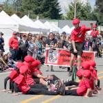 The Snoqualmie Valley Unicycle Club attempts a big jump stunt during the parade. Evan Pappas/Staff Photo
