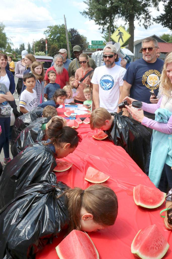A huge crowd gathers for the watermelon eating contest. Evan Pappas/Staff Photo