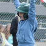 April Snow celebrates scoring after running the bases with team Snoqualmie parent Brandon Duffy. Andy Nystrom / staff photo