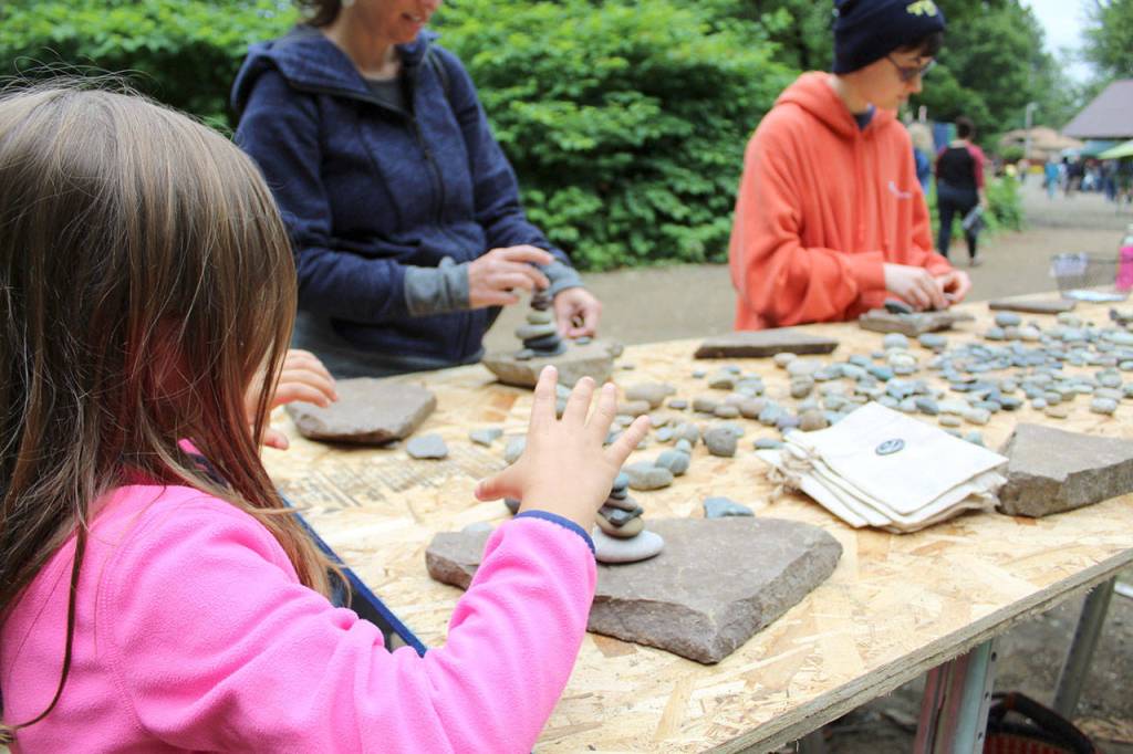 Kids and adults participate in the Saturday Rise with Art event at site of the Art Barn project on E North Bend Way. Photo courtesy of The Sprouting Image.