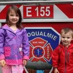 6-year-old Finley Gendron (left) and her little brother, Boston Gendron, explore the citys fire truck during Big Truck Day. Madison Miller / staff photo