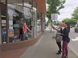 A consultant working with store owner in downtown Renton. In 2018, Renton hosted a several workshops called Creating Stellar Storefronts funded through the Economic Development Partnership program. Courtesy of the Port of Seattle