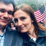 Photo courtesy of Ksenia Khokhlov                                Ksenia Khokhlov (left) and her husband Anton Khokhlov are all smiles as they wait to be sworn in as U.S. citizens at the ceremony on July 4 at Seattle Center.
