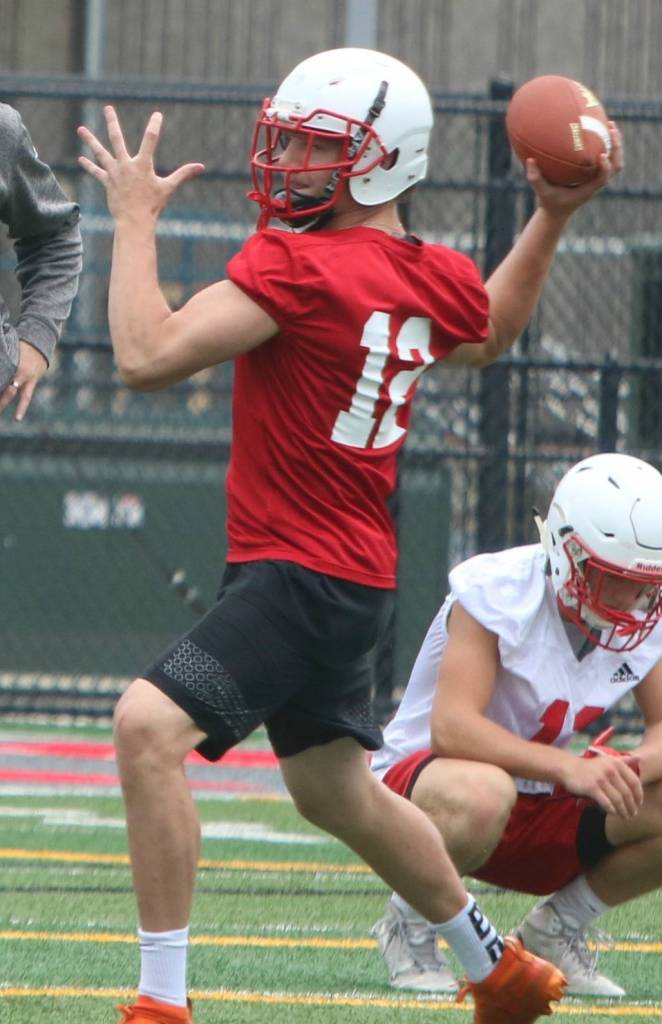 Wildcat quarterback Clay Millen searches for a receiver. Andy Nystrom/ staff photo