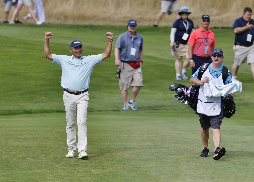 Fred Couples comes up the fairway to retrieve his hole in one on the 207-yard par 3, over water and bunkers, on Aug. 24 at the Boeing Classic at The Club at Snoqualmie Ridge. Photo courtesy of Jim Nicholson