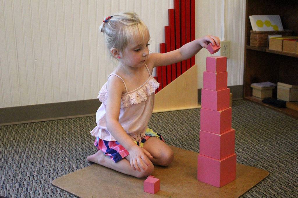 Photos by Madison Miller / staff photo                                Harper Lenihan, 4, plays with blocks at Mount Si Montessori.