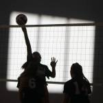 Another artistic shot displays strong net play during practice. Andy Nystrom/ staff photo