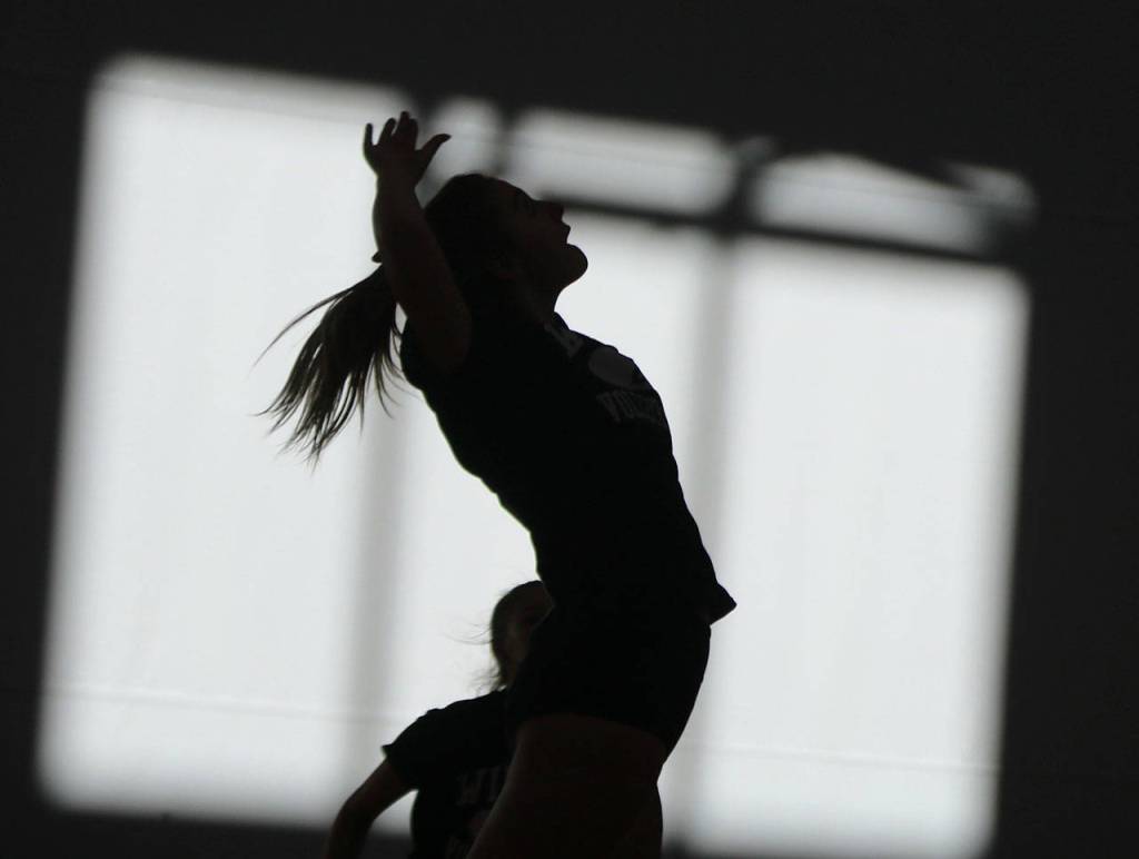 Getting air while preparing for a hit. Andy Nystrom/ staff photo