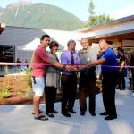 Photo by Natalie DeFord                                Brenden Elwood, Jeanne Pettersen, Mayor Ken Hearing, Alan Gothelf and Ross Loudenback perform the ribbon cutting at a special ceremony at North Bends new City Hall Sept. 5.