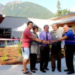 Photo by Natalie DeFord                                Brenden Elwood, Jeanne Pettersen, Mayor Ken Hearing, Alan Gothelf and Ross Loudenback perform the ribbon cutting at a special ceremony at North Bends new City Hall Sept. 5.