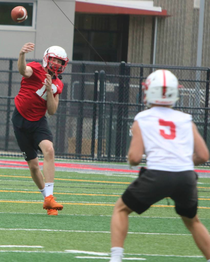 Mount Si quarterback Clay Millen throws the ball while on the run during practice. Andy Nystrom/ staff photo