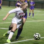 Mount Sis Sydney Dunn blasts by a North Creek player. Andy Nystrom/ staff photo