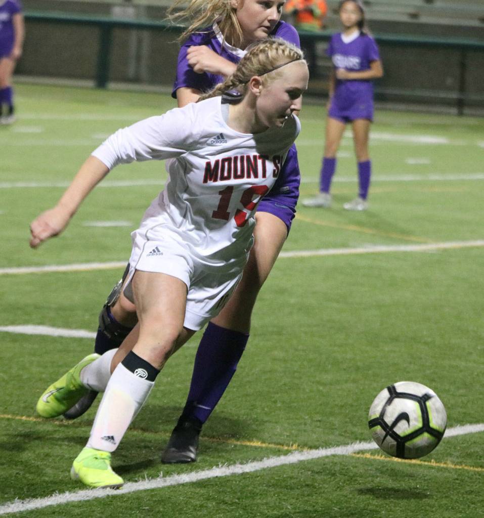 Mount Sis Sydney Dunn blasts by a North Creek player. Andy Nystrom/ staff photo