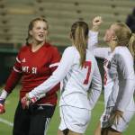 Mount Sis Kylie Hunter, Maddie Lilleberg and Maggie Mitchell get hyped up for the second half against North Creek. Andy Nystrom/ staff photo
