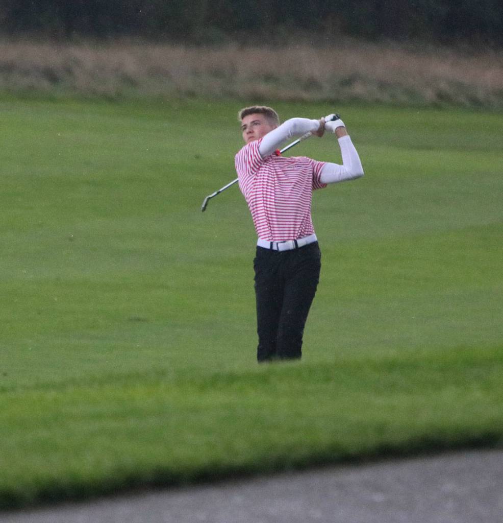 Mount Sis Drew Warford swings away on the second hole at The Club at Snoqualmie Ridge on Oct. 3. Andy Nystrom/ staff photo
