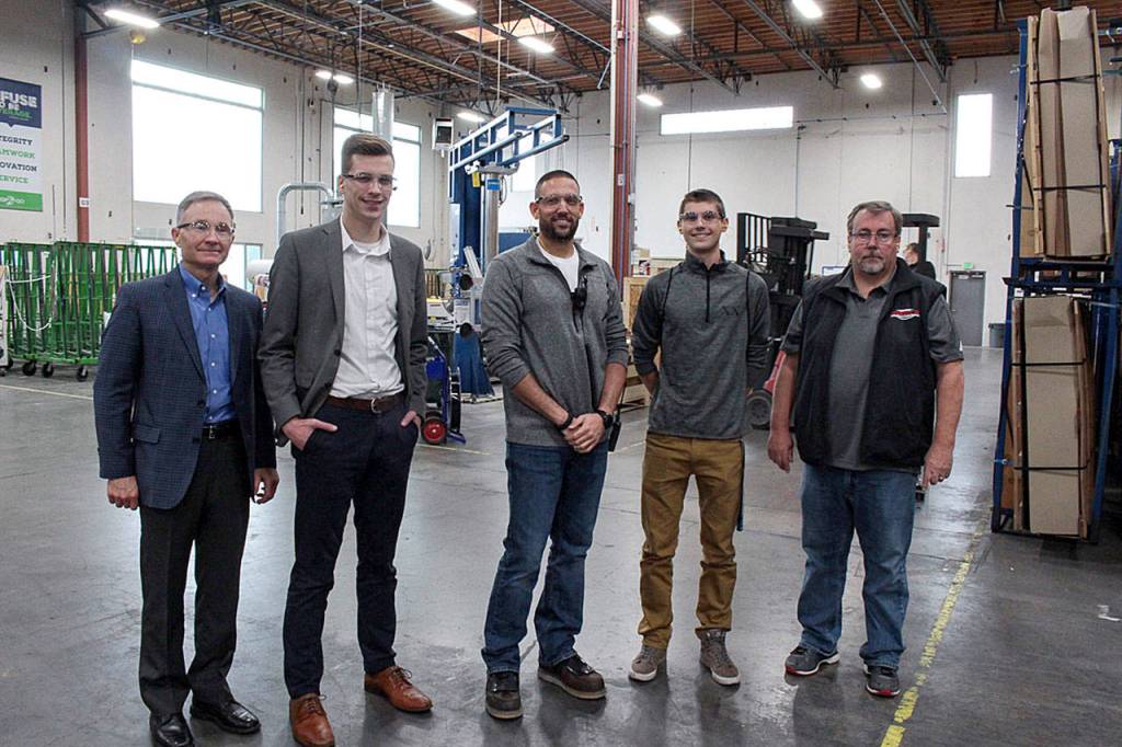 Natalie DeFord/Staff photo                                A group tours the facilities at Allegion (Technical Glass Products) during the companys Manufacturing Day event. From left, Snoqualmie city administrator Bob Larson, Casey Duff from Sen. Maria Cantwells office, production manager Dave Jensen, Mount Si High School senior Dylan Van Vleet, Mount Si teacher Gregg Meyers.