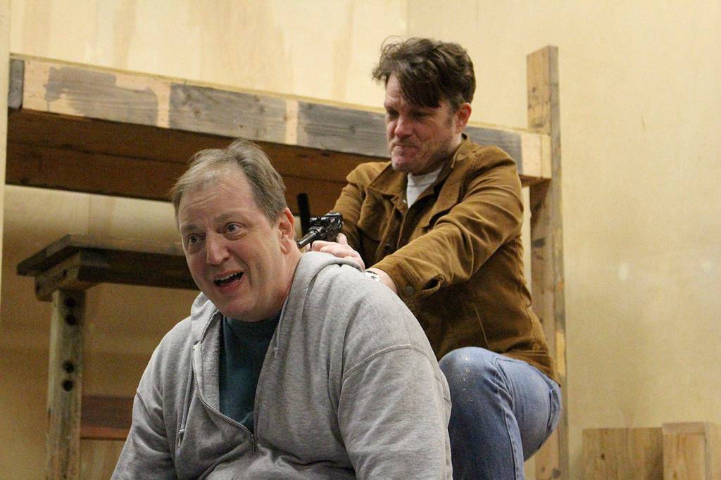 John Williams Lynch (Lennie) and Tom Stewart (George) rehearse one of the final scenes in VCSs production of Of Mice and Men premiering Oct. 17. Madison Miller / staff photo